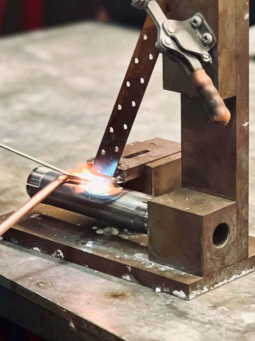 Torch brazing a tube assembly in a fixture
